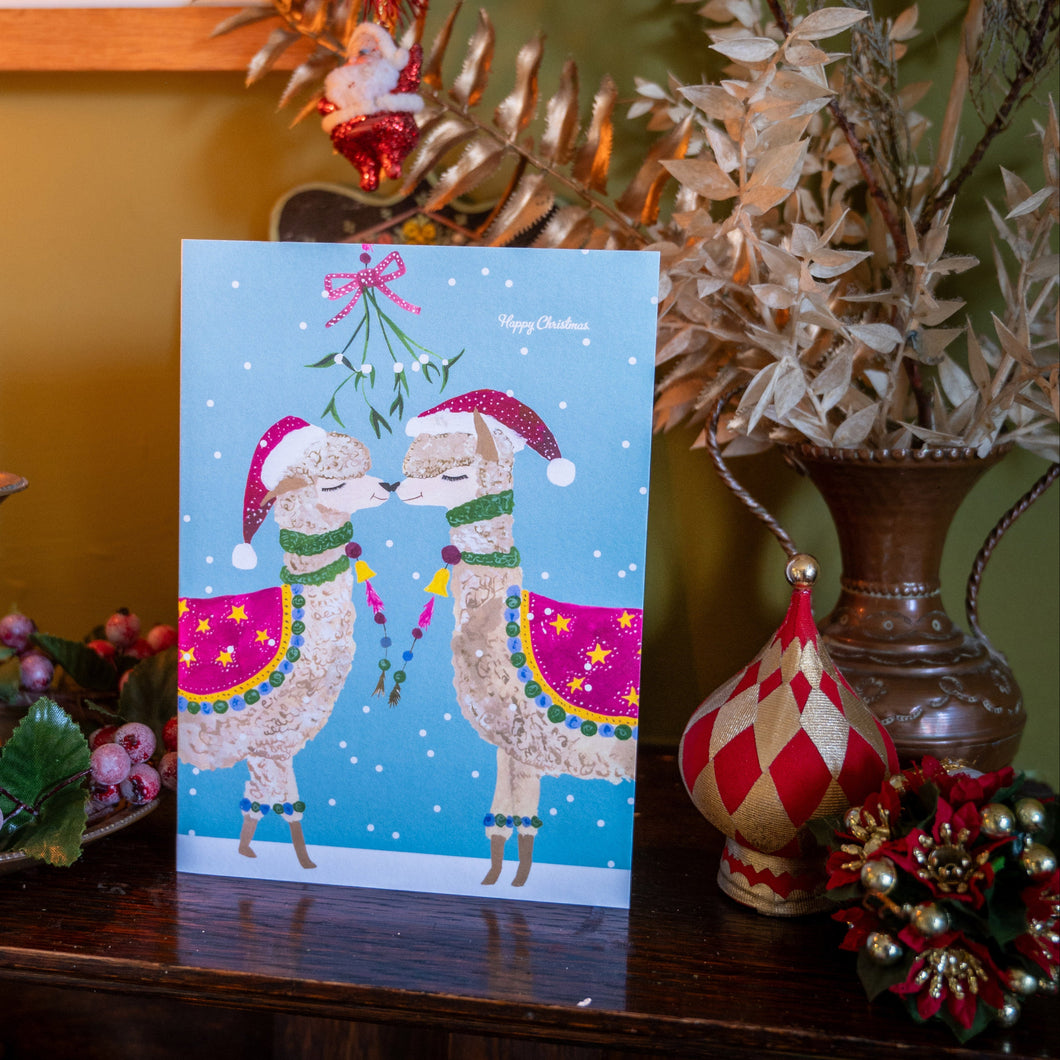 Alpaca kissing under the mistletoe Christmas Card