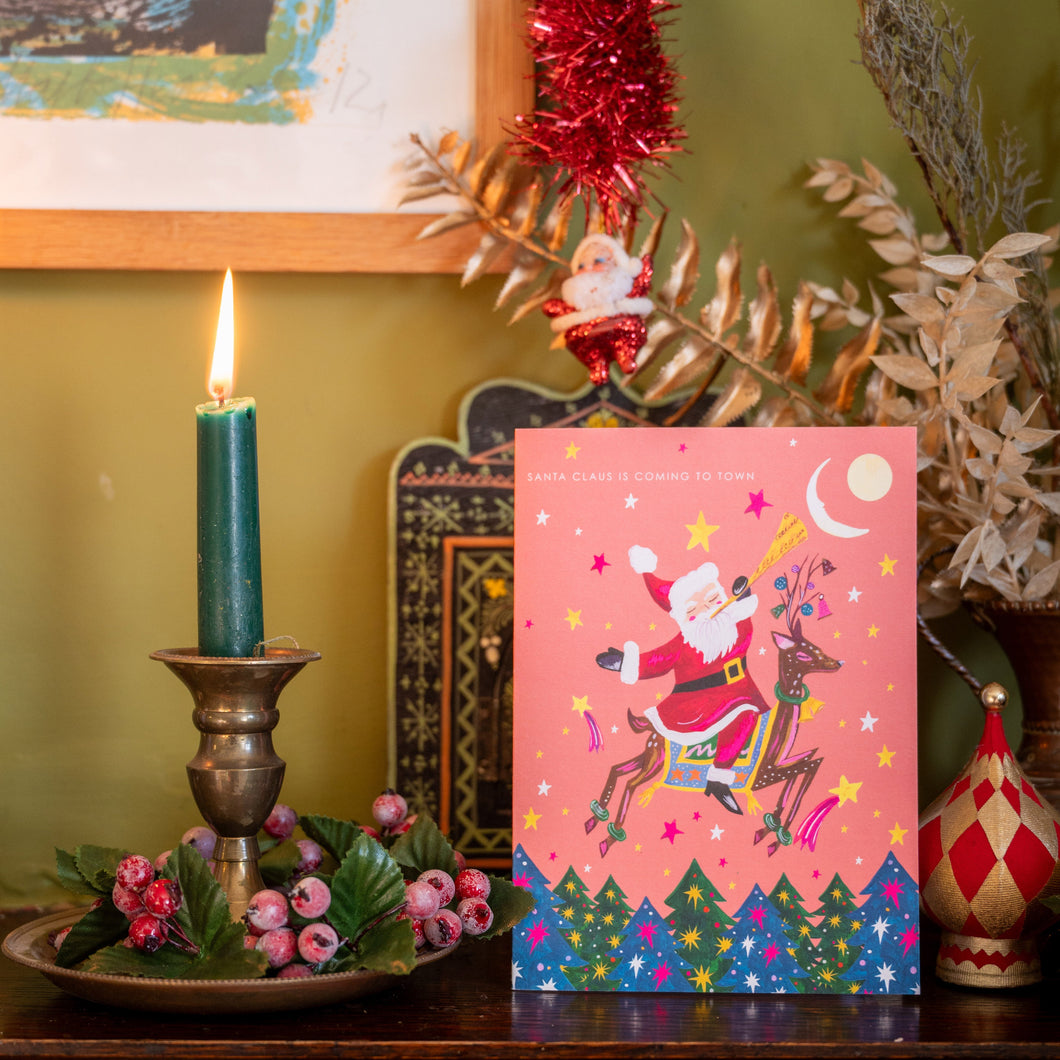 Santa on Reindeer Christmas Card